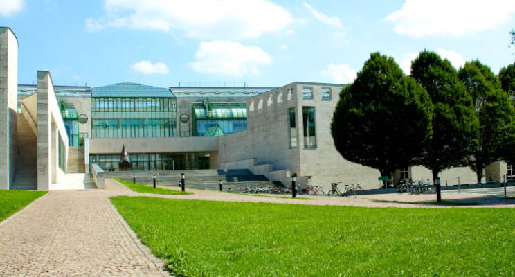 The outside of the Faculty of Natural and Life Sciences building: a large, modern building with several glass-house style atriums.